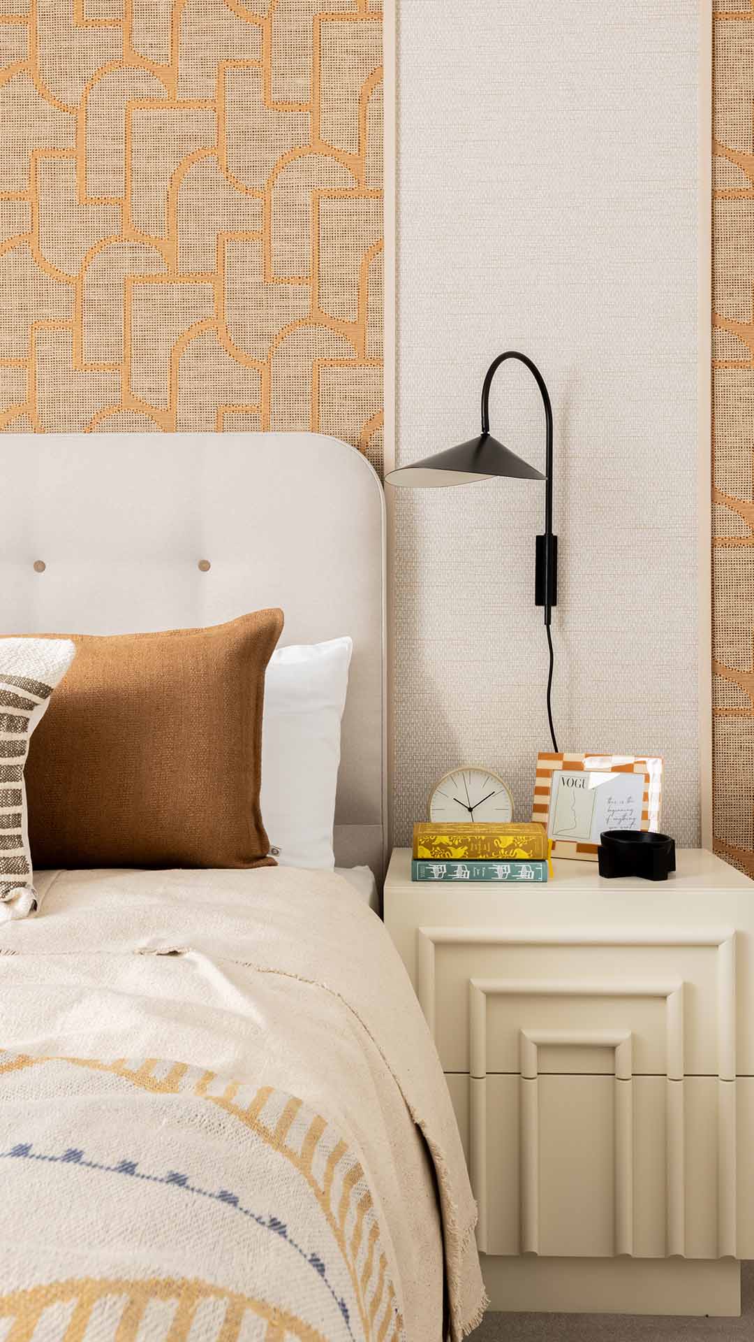 Stylish nightstand with books and decor of Fulton & Fifth